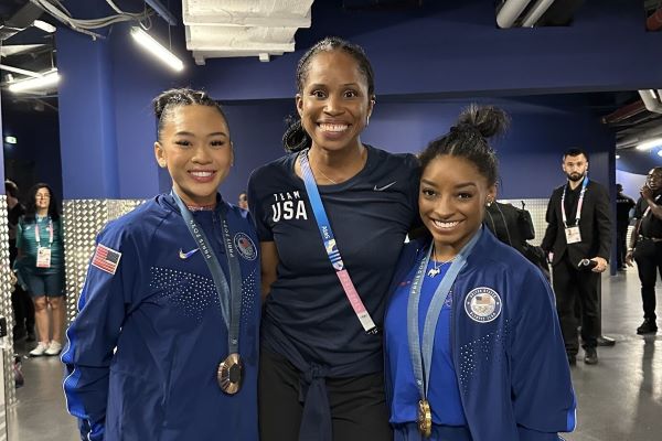 Dr. Marcy with Olympians